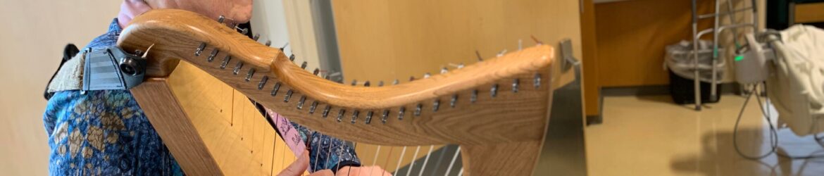 Edie Elkan plays the harp as part of the music therapy program at Robert Wood Johnson Hospital in New Jersey.Credit...Edie Elkan